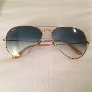 Gold framed Ray Bans with blue ombré lenses